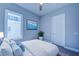 A serene bedroom decorated with an art piece and plant at 7760 Sandy Ridge Dr # 222, Kissimmee, FL 34747