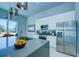 Modern kitchen featuring stainless steel appliances, center island, and ample counter space at 7760 Sandy Ridge Dr # 222, Kissimmee, FL 34747