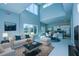 Bright living room featuring high ceilings, lots of natural light, and modern furnishings at 7760 Sandy Ridge Dr # 222, Kissimmee, FL 34747