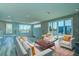 Open living room with waterfront views and modern furnishings at 7760 Sandy Ridge Dr # 222, Kissimmee, FL 34747
