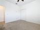 Cozy bedroom with neutral carpet, a closet, and neutral wall paint at 8914 Dove Valley Way, Davenport, FL 33896
