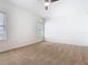 Bedroom features carpeted floor, window, and ceiling fan at 8914 Dove Valley Way, Davenport, FL 33896