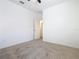 Bedroom with neutral carpet, white walls, ceiling fan, and a doorway to another room at 8914 Dove Valley Way, Davenport, FL 33896