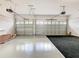 Spacious garage with two car doors, high ceilings, and ample room for storage and vehicles at 8914 Dove Valley Way, Davenport, FL 33896