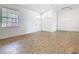 Bright living room showcasing a large window, tile flooring, and a convenient double-door closet at 8914 Dove Valley Way, Davenport, FL 33896