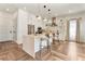 Modern kitchen with stainless steel appliances, a spacious island, and stylish pendant lighting at 1606 Hart Ln, Orlando, FL 32804