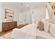 Spacious main bedroom featuring a comfortable bed, stylish decor, and access to an ensuite bathroom at 1606 Hart Ln, Orlando, FL 32804