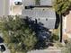 Aerial view of gray house with dark roof and surrounding trees and street at 2212 Atrium Cir, Orlando, FL 32808