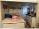 This cozy bedroom features tile flooring, a white bed frame, dresser, and stylish decor at 2212 Atrium Cir, Orlando, FL 32808