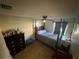 Simple bedroom with carpet, ceiling fan, and wood furniture offers a calm and relaxing space at 2212 Atrium Cir, Orlando, FL 32808