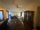 Bright living room and dining area with hardwood floors, ceiling fan, and stylish furniture at 2212 Atrium Cir, Orlando, FL 32808