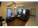 Comfortable living room offers hardwood flooring, natural light, and an adjacent dining space at 2212 Atrium Cir, Orlando, FL 32808