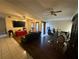 Cozy living room features hardwood floors, ceiling fans, and a decorative dining area at 2212 Atrium Cir, Orlando, FL 32808