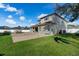 Large backyard with patio, grassy area, and two-story home at 698 Mt Pleasant Dr, Ocoee, FL 34761