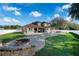 Landscaped backyard with pool, patio, and fire pit at 698 Mt Pleasant Dr, Ocoee, FL 34761