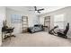 Bright bedroom with a twin bed, built-in shelving, and a gaming setup at 698 Mt Pleasant Dr, Ocoee, FL 34761