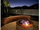 Inviting outdoor fire pit featuring brick surround and stone pavers, perfect for cozy evenings and outdoor gatherings at 698 Mt Pleasant Dr, Ocoee, FL 34761