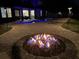 Cozy outdoor space featuring a modern fire pit, pool, and open layout, perfect for relaxation and entertainment under the stars at 698 Mt Pleasant Dr, Ocoee, FL 34761