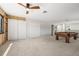 Large game room with a pool table, plenty of closet space, and neutral carpeting at 698 Mt Pleasant Dr, Ocoee, FL 34761
