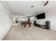 Spacious game room with a pool table, large windows, a wall-mounted TV and neutral carpeting at 698 Mt Pleasant Dr, Ocoee, FL 34761