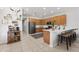 Stylish kitchen with wooden cabinets, stainless steel appliances, and a decorative bull skull on the wall at 698 Mt Pleasant Dr, Ocoee, FL 34761