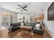 Open-concept living room features hardwood floors and an adjacent kitchen and dining area at 698 Mt Pleasant Dr, Ocoee, FL 34761