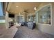 Spacious backyard patio with seating area, outdoor kitchen, and large windows at 698 Mt Pleasant Dr, Ocoee, FL 34761