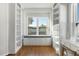 Charming reading nook with built-in bookshelves and window seat at 698 Mt Pleasant Dr, Ocoee, FL 34761