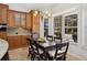 Cozy dining room with a large window overlooking the backyard and its sparkling swimming pool at 1000 Dunhurst Ct, Longwood, FL 32779