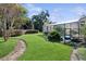 Screened pool and spa area with lush landscaping at 1000 Dunhurst Ct, Longwood, FL 32779