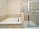 Bathroom with soaking tub and walk-in shower at 1720 Garden Sage Dr, Oviedo, FL 32765