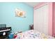 bedroom with butterfly bedding and a keyboard at 1720 Garden Sage Dr, Oviedo, FL 32765