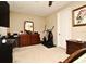 Bedroom with dresser, elliptical machine, and nightstand at 1720 Garden Sage Dr, Oviedo, FL 32765