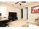 Home office with TV, desk, and couch at 1720 Garden Sage Dr, Oviedo, FL 32765