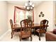 Dining area features a large wood table and chandelier at 1720 Garden Sage Dr, Oviedo, FL 32765