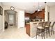 Kitchen boasts granite countertops, stainless steel appliances, and breakfast bar at 1720 Garden Sage Dr, Oviedo, FL 32765