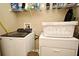 Laundry room with washer, dryer, and shelving at 1720 Garden Sage Dr, Oviedo, FL 32765