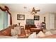 Spacious living room featuring a comfortable leather sofa and large TV at 1720 Garden Sage Dr, Oviedo, FL 32765