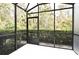 Peaceful screened porch overlooking a lush, green backyard at 1720 Garden Sage Dr, Oviedo, FL 32765