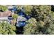 Aerial view showcasing a home surrounded by lush trees and foliage at 403 Tranquille Oaks Dr, Ocoee, FL 34761