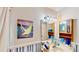 Well-lit bathroom with vanity, mirror, and decorative wall art at 403 Tranquille Oaks Dr, Ocoee, FL 34761