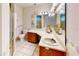 Bathroom includes a vanity with sink, mirror, and shower with glass doors at 403 Tranquille Oaks Dr, Ocoee, FL 34761