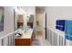 Well-lit bathroom with a vanity, mirror, and decorative details, offering a fresh look at 403 Tranquille Oaks Dr, Ocoee, FL 34761