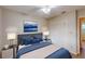 Comfortable bedroom featuring neutral décor and a large window for natural light at 403 Tranquille Oaks Dr, Ocoee, FL 34761