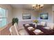 Formal dining room showcasing stylish furnishings and a decorative chandelier at 403 Tranquille Oaks Dr, Ocoee, FL 34761