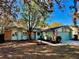 Charming exterior of a single-story home featuring a well-maintained lawn and inviting curb appeal at 403 Tranquille Oaks Dr, Ocoee, FL 34761