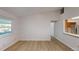 Bright and airy living room with wood floors and natural light from large windows at 403 Tranquille Oaks Dr, Ocoee, FL 34761