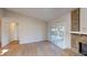 The living room shows a sliding door, brick fireplace, and doorway to another room at 403 Tranquille Oaks Dr, Ocoee, FL 34761