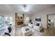 Bright living room featuring a brick fireplace, neutral paint, and plenty of seating at 403 Tranquille Oaks Dr, Ocoee, FL 34761