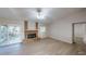 A bright living room with a brick fireplace and sliding doors to the outdoor area at 403 Tranquille Oaks Dr, Ocoee, FL 34761